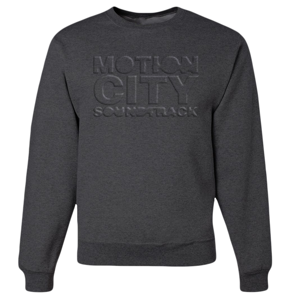 Dark grey crewneck with MOTION CITY SOUNDTRACK in embossed lettering on the chest